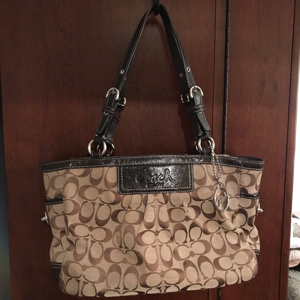 Brown Coach purse with light purple lining